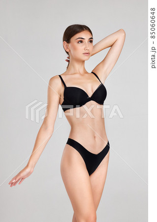 gorgeous slim woman with perfect body in black underwear gorgeous slim woman with perfect body in black underwear 85060648
