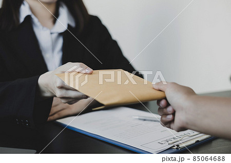Businessmen make an agreement with the money proposed his partner to bribe in the company. The concept of bribery and corruption Businessmen make an agreement with the money proposed his partner to bribe in the company. The concept of bribery and corruption 85064688