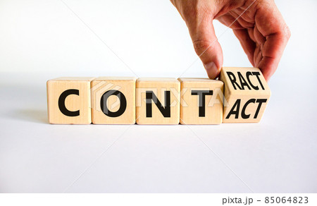 From contact to contract symbol. Businessman turns a wooden cube and changes the word contact to contract. Beautiful white background, copy space. Business, from contact to contract concept. From contact to contract symbol. Businessman turns a wooden cube and changes the word contact to contract. Beautiful white background, copy space. Business, from contact to contract concept. 85064823