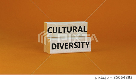 Time to cultural diversity symbol. Wooden blocks with words 'Cultural diversity'. Beautiful orange background. Business and cultural diversity concept. Copy space. Time to cultural diversity symbol. Wooden blocks with words 'Cultural diversity'. Beautiful orange background. Business and cultural diversity concept. Copy space. 85064892