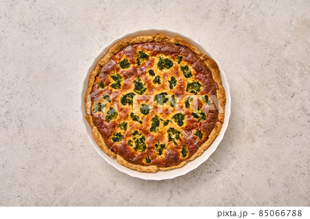 Quiche pie with broccoli, tuna and cheese in white baking dish Quiche pie with broccoli, tuna and cheese in white baking dish 85066788