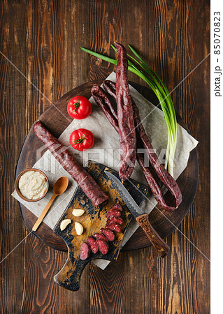 Overhead view of dried sausage made of venison spicy meat Overhead view of dried sausage made of venison spicy meat 85070823