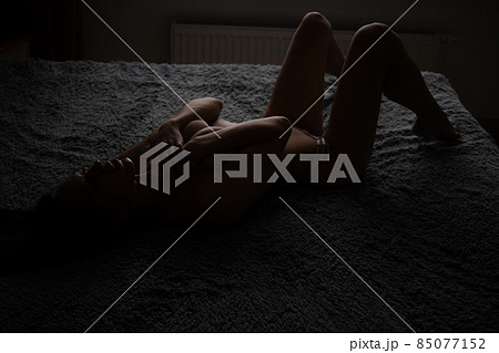 Alluring topless woman touching herself in bedroom Alluring topless woman touching herself in bedroom 85077152