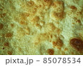Closeup view of hand made plain bread in oil called paratha roti. 85078534