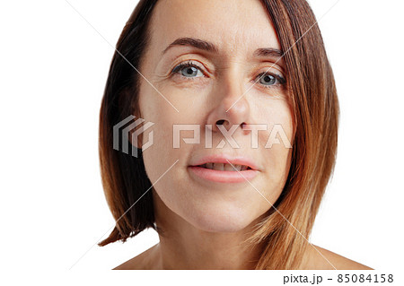 Close-up portrait of woman. Female face without makeup. Anti-aged cosmetology, well-kept skin, medicine and health. 85084158