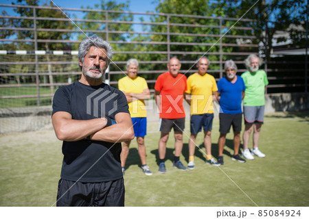Portrait of serious senior man on football field Portrait of serious senior man on football field 85084924