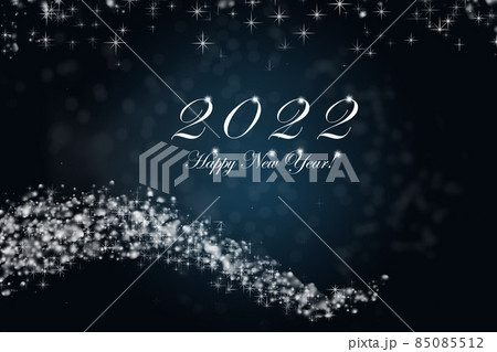 Happy New Year 2022. Sparkling burning numbers Year 2022 with stars and bokeh on blue background. Happy New Year 2022. Sparkling burning numbers Year 2022 with stars and bokeh on blue background. 85085512
