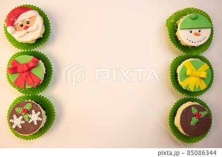 Christmas cupcakes, New Year's dessert. Santa claus cupcakes, snowman cupcakes. Dessert for new year and christmas 85086344