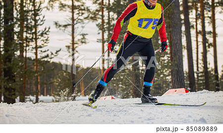 male skier running cross-country skiing 85089889