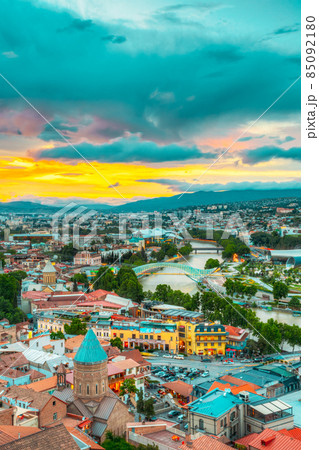 Top View Old Colorful Town, Kura Mtkvari River Summer Tbilisi, Georgia. Scenic Sunset Sky Background Top View Old Colorful Town, Kura Mtkvari River Summer Tbilisi, Georgia. Scenic Sunset Sky Background 85092180