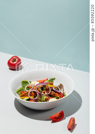 Salad with grilled eel and vegetables tomatoes onion eggs hard shadows modern Salad with grilled eel and vegetables tomatoes onion eggs hard shadows modern 85092220