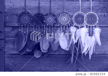 Handmade dream catcher with feathers threads and beads rope in very peri trendy color of the year 2022. 85092334