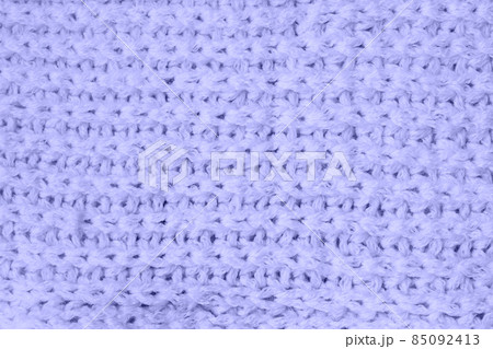 Sweater or scarf Pattern Of Knitted Fabric Texture Background in very peri trendy color of the year 2022. Sweater or scarf Pattern Of Knitted Fabric Texture Background in very peri trendy color of the year 2022. 85092413