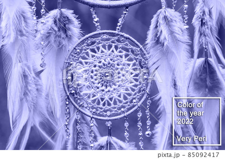Handmade dream catcher with feathers threads and beads rope in very peri trendy color of the year 2022. Handmade dream catcher with feathers threads and beads rope in very peri trendy color of the year 2022. 85092417