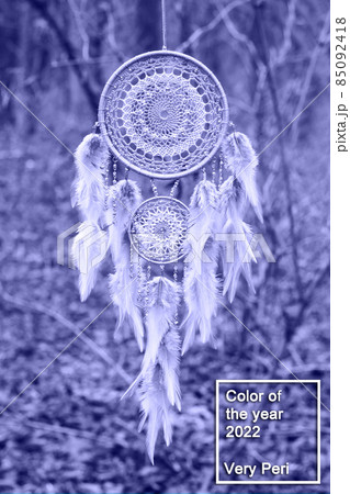 Handmade dream catcher with feathers threads and beads rope in very peri trendy color of the year 2022. 85092418