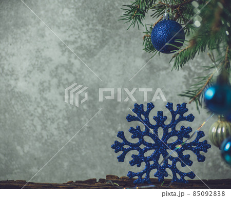 Spruce branches decorated with blue Christmas toys Spruce branches decorated with blue Christmas toys 85092838