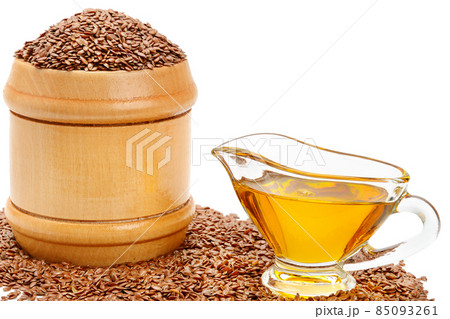 Flax seeds and linseed oil isolated on white . Free space for text. Flax seeds and linseed oil isolated on white . Free space for text. 85093261