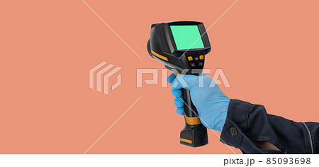man in rubber gloves holds a thermographic camera. device for monitoring the temperature man in rubber gloves holds a thermographic camera. device for monitoring the temperature 85093698
