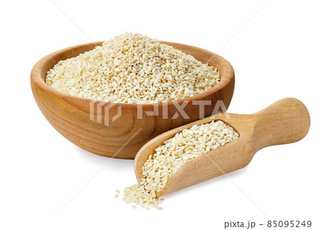 sesame seeds in wooden bowl and scoop isolated sesame seeds in wooden bowl and scoop isolated 85095249