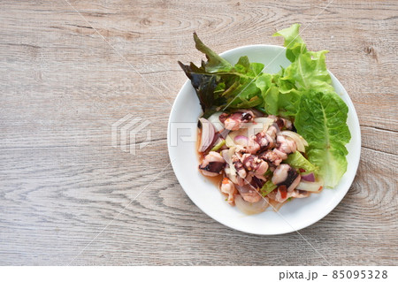 Thai spicy squid salad and fresh vegetable on plate Thai spicy squid salad and fresh vegetable on plate 85095328
