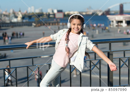 Let the music take you away. Little child listen to music  85097090