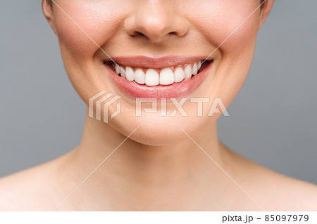Perfect healthy teeth smile of a young woman. Teeth whitening. Dental clinic patient. Image symbolizes oral care dentistry, stomatology Perfect healthy teeth smile of a young woman. Teeth whitening. Dental clinic patient. Image symbolizes oral care dentistry, stomatology 85097979