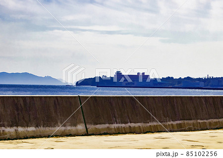 View of a part of Ibusuki city, from one of its harbors, over a concrete wall. 85102256