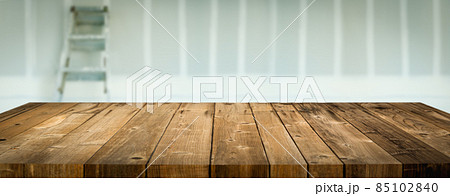 Empty Wood Table Surface Display Background with Construction Theme Behind. Empty Wood Table Surface Display Background with Construction Theme Behind. 85102840
