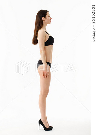 Foto de Model tests. Snap Models back view, Beautiful brunette woman in  underwear, isolated on white. do Stock