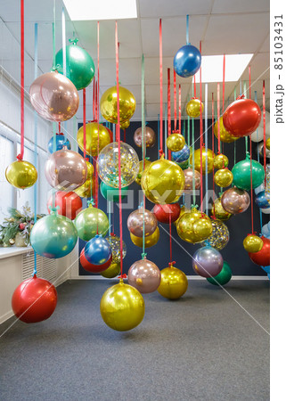 Christmas balls are hung on ribbons. Celebrating new year, christmas 85103431