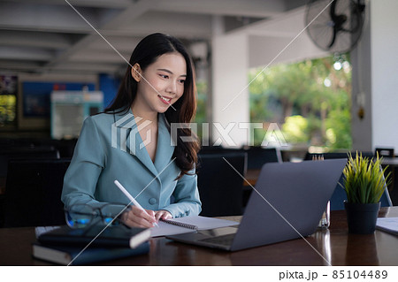Asian business woman using laptop talk to colleagues for briefing business plan in video call. finance fund investment concept. Asian business woman using laptop talk to colleagues for briefing business plan in video call. finance fund investment concept. 85104489