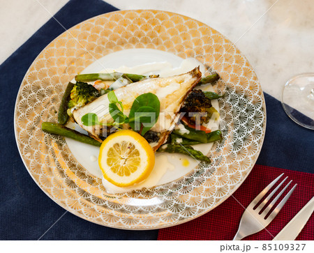Delicious fish dish - dorado fish fillet served with vegetables Delicious fish dish - dorado fish fillet served with vegetables 85109327