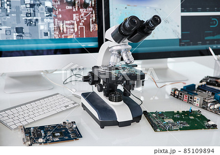 Microscope of scientific researcher standing on desk 85109894
