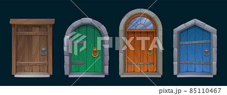 Old medieval wooden doors with stone arch 85110467