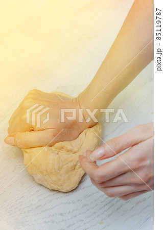girl makes homemade dough in the kitchen. concept of home cooking. making homemade dough 85119787