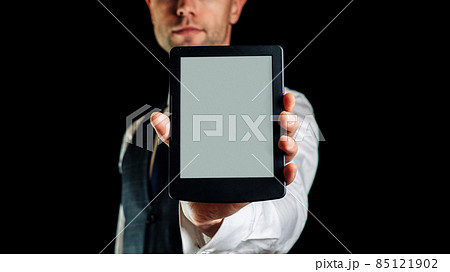 E reader. Digital e book, library reader tablet in business man hand. Online education course, E learning class and ebook digital technology concept. E reader. Digital e book, library reader tablet in business man hand. Online education course, E learning class and ebook digital technology concept. 85121902