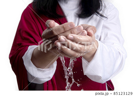 Jesus Christ with open palm giving hold the water 85123129