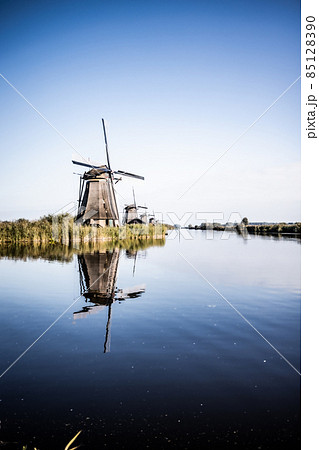 Vertical picture of one of the famous Dutch windmills at Kinderdijk, a UNESCO world heritage site Vertical picture of one of the famous Dutch windmills at Kinderdijk, a UNESCO world heritage site 85128390