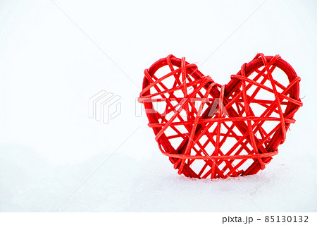 Wooden red heart made of twigs on a white background. Eco-friendly valentines day. Sustainable lifestyle. Wooden red heart made of twigs on a white background. Eco-friendly valentines day. Sustainable lifestyle. 85130132