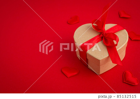 Gift boxe in heart shape with bow on red background, Saint Valentine Day 85132515