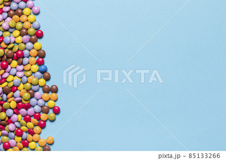 colorful gem candies side blue background. High quality photo colorful gem candies side blue background. High quality photo 85133266