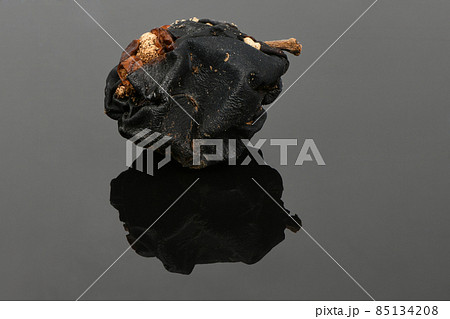 Rotten apple on black acrylic background. Rotten apple on black acrylic background. 85134208
