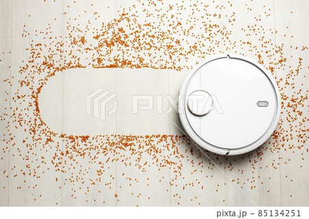 flat lay wireless controlled vacuum cleaner. High quality photo 85134251