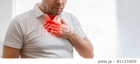 The young man is suffering from heartburn. Disease of the gastrointestinal tract. Sore throat. The young man is suffering from heartburn. Disease of the gastrointestinal tract. Sore throat. 85135800