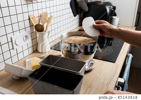 The process of making rye bread. Dough on rye bread before dividing. Front view. The process of making rye bread. Dough on rye bread before dividing. Front view. 85143918