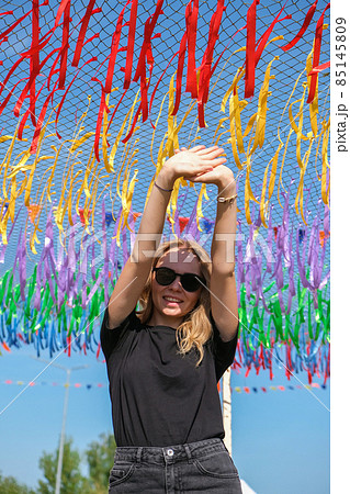 Young woman on festival. Gen z girl enjoying outdoors, expressing positive emotions having fun in park. Millennial generation lifestyle. Young woman on festival. Gen z girl enjoying outdoors, expressing positive emotions having fun in park. Millennial generation lifestyle. 85145809