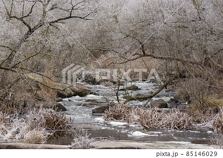Beautiful winter landscape with Girskiy Tikych river running through frosted trees and rocks. Beautiful winter landscape with Girskiy Tikych river running through frosted trees and rocks. 85146029