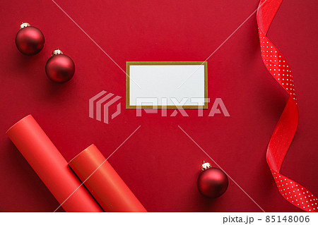 Holiday brand identity design and Christmas flatlay concept. White blank business card and xmas ornament and decoration on red paper background as flat lay mockup Holiday brand identity design and Christmas flatlay concept. White blank business card and xmas ornament and decoration on red paper background as flat lay mockup 85148006