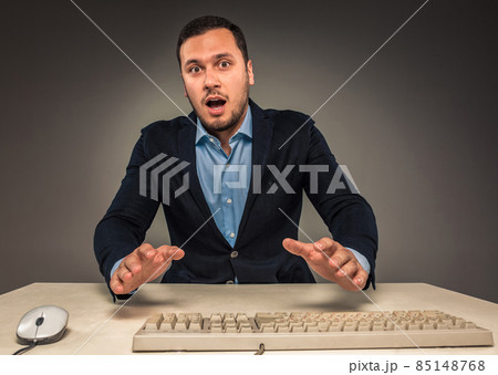Portrait young man in blue shirt, looking with amazement 85148768