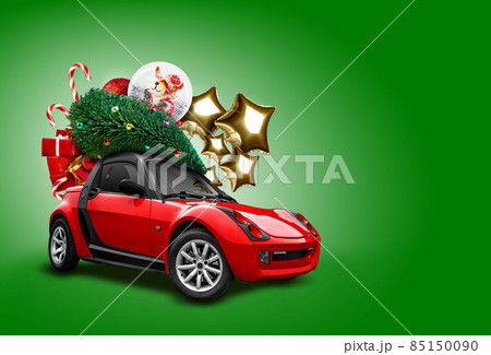 Red car on green background. Christmas tree, presents, balloons in form of golden stars, snow globe, candies on roof. Collage. Copy space, close-up. Red car on green background. Christmas tree, presents, balloons in form of golden stars, snow globe, candies on roof. Collage. Copy space, close-up. 85150090